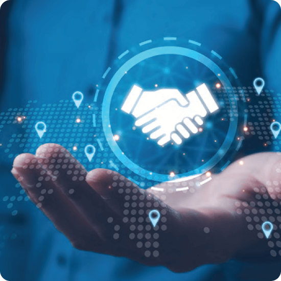 A hand holding a holographic image of a handshake, symbolizing global business partnerships and collaboration.