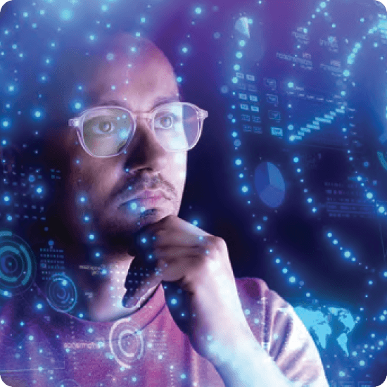 A pensive man wearing glasses contemplates data visualizations projected onto screen